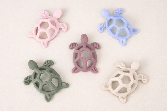 This teether is super soft, but sturdy for sore little gums to chomp on!
All 4 legs and the shell are ribbed for great texture. 
It has gaps all around for little fingers to grab onto and pull up to their mouths. 
Great for hand eye coordination skills!